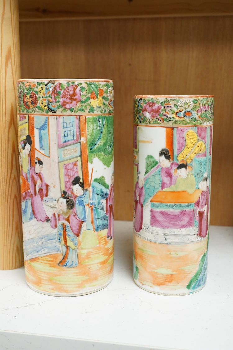Two 19th century Chinese famille rose cylindrical vases and a similar bottle vase, 21cm